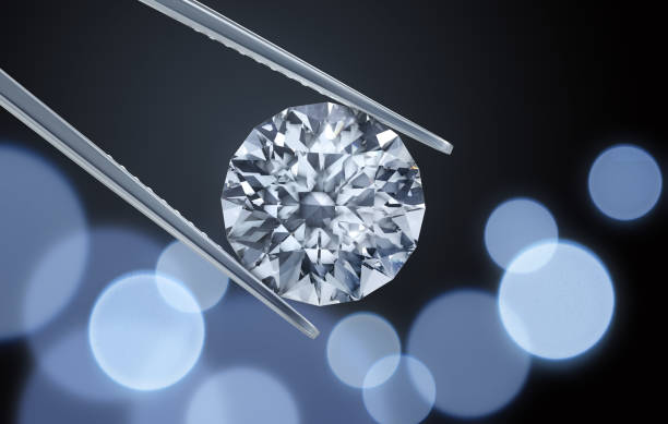 istock Large Diamond with Tweezers 1252617196