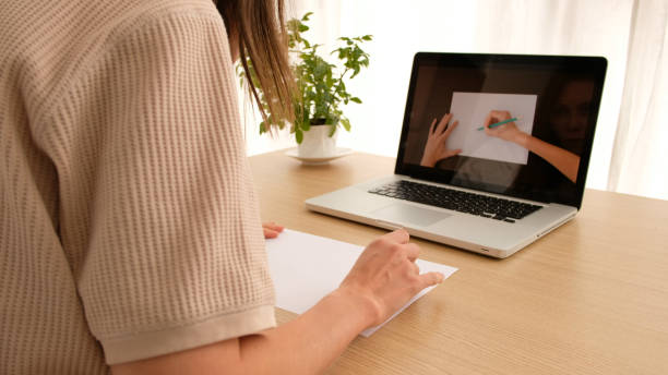 istock Woman learns to draw online 1252617241