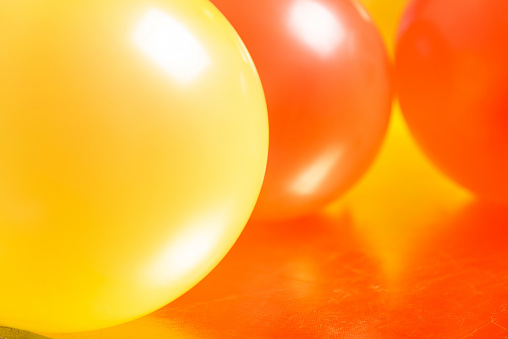 Colorful balloons celebration abstract background closeup