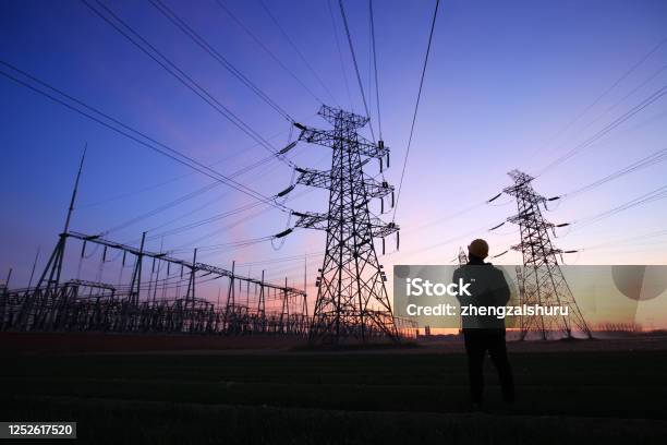 Electricity Workers And Pylon Silhouette Stock Photo - Download Image Now - Electricity, Power Line, Power Station