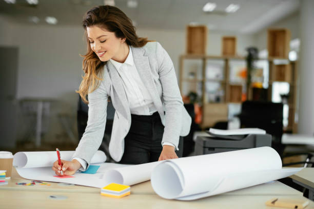 istock Beautiful businesswoman working on project. 1252621859
