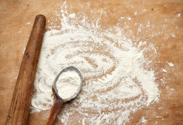 istock old wooden rolling pin on a brown background, top view 1252621888