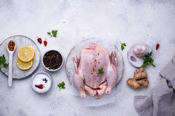 istock Raw chicken with herbs and spices 1252624289