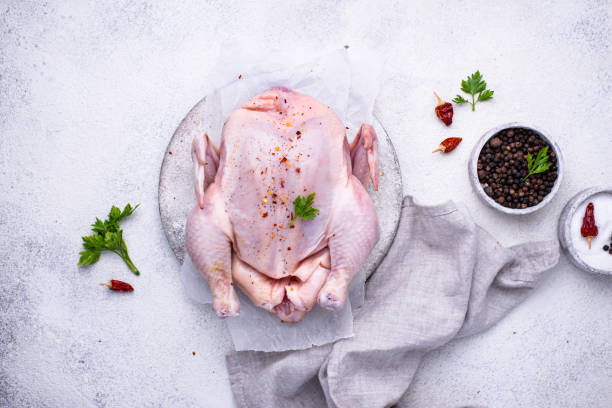 istock Raw chicken with herbs and spices 1252624293