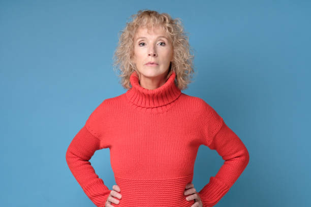 istock Senior woman smiling looking confident at camera. 1252625156