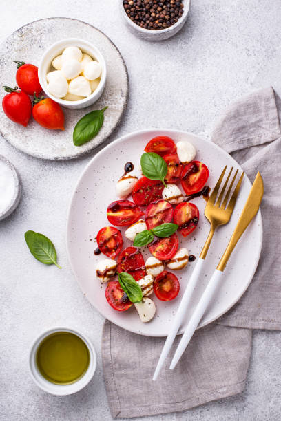 istock Caprese salad with tomatoes and mozzarella 1252625609