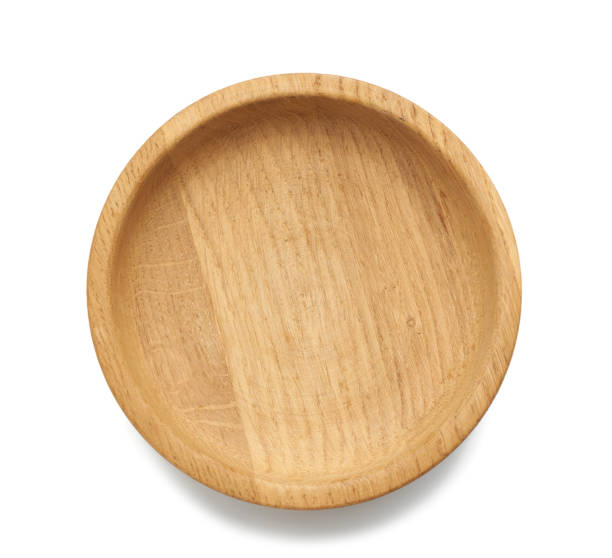istock empty brown round wooden plate isolated on white background 1252625758