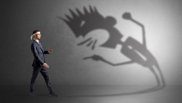 istock Karate man fighting with a big scary shadow 1252627335