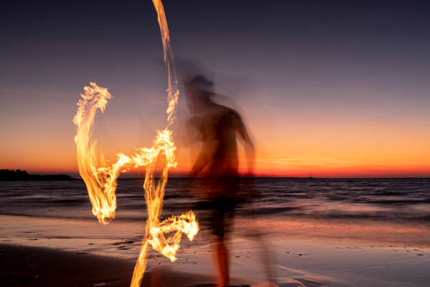 fire dancer - darwin northern territory australia beach imagens e fotografias de stock