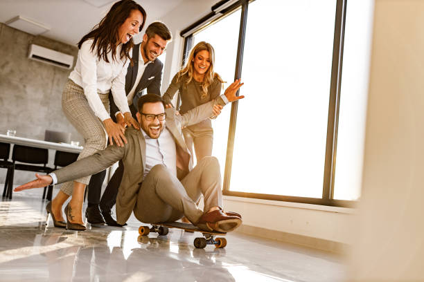 istock Playful business people having fun in the office. 1252648577
