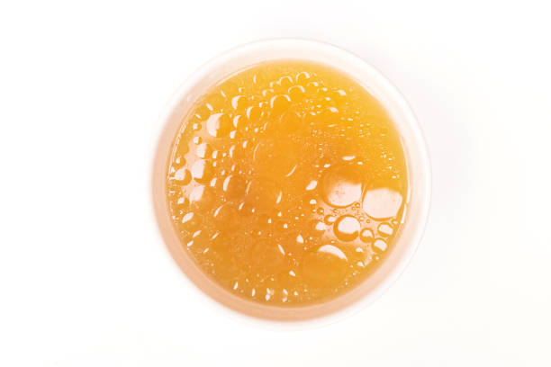 istock Bowl of chicken broth isolated on white background 1252654635