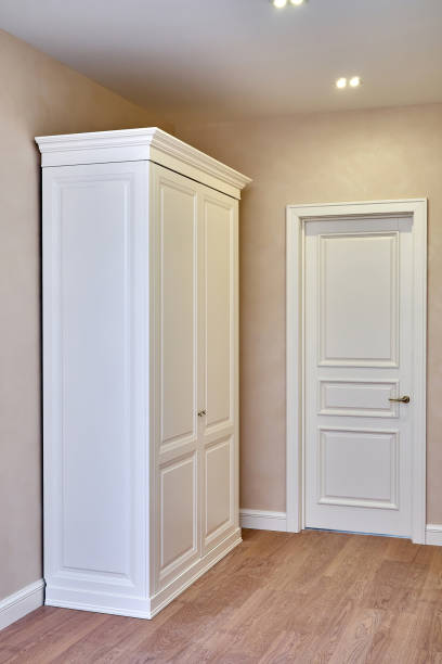 istock Classic wardrobe and interior door in beige interior 1252656162