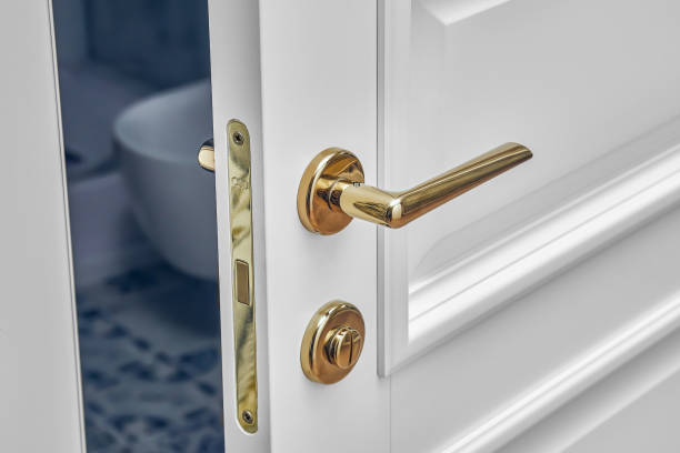 Classic style white door. Classic white door with golden handle. Opened white door to the bathroom. Close-up Classic style white door. Opened white door to the bathroom. Classic white door with golden handle. Close-up metal molding stock pictures, royalty-free photos & images