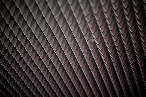 Abstract black geometric texture or background. Diamond-shaped soundproofing in modern music or media studio Abstract black geometric texture or background. Diamond-shaped soundproofing in modern music or media studio. acoustic music photos stock pictures, royalty-free photos & images