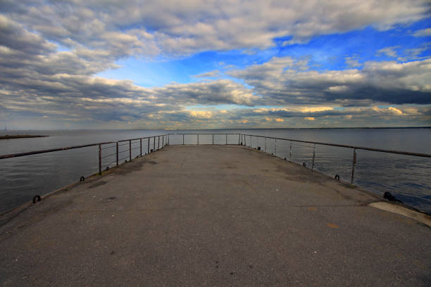istock asphalt pier on the shore 1252671113
