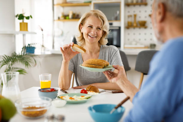 istock Happy senior couple discussing while having breakfast 1252674605