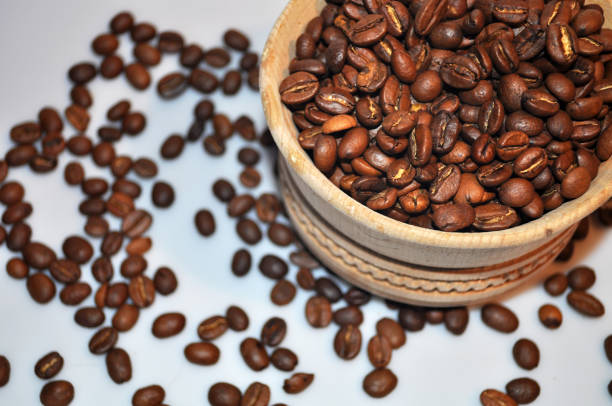 istock black coffee beans on a white background 1252675023