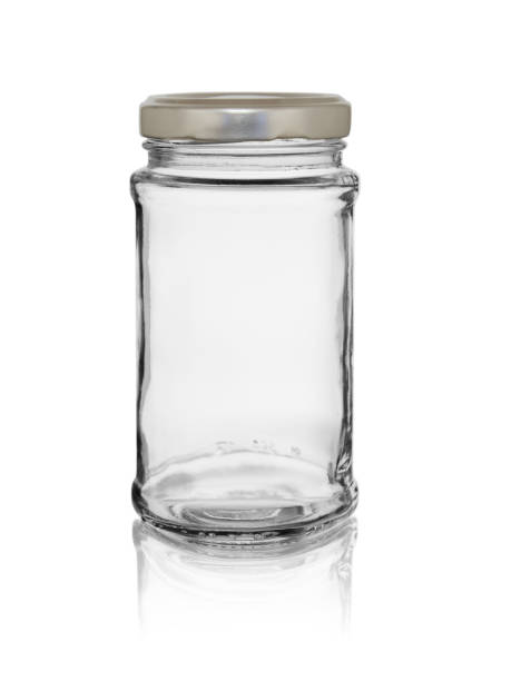 istock Empty glass jar with a lid. Isolated on a white background with reflection 1252675253