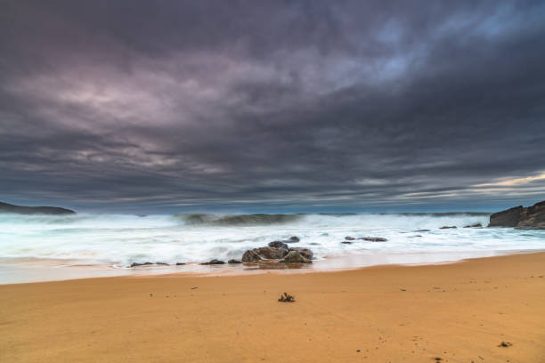 istock Moody Seascape with Large and Powerful Surf 1252677423