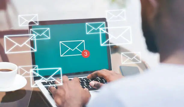 Photo of Creative Collage Of Unrecognizable Black Man Checking Inbox Emails In Cafe