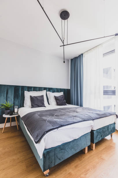 istock Cozy bedroom with comfortable bed in modern studio apartment. 1252679506