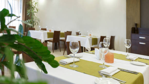 istock Plant in restaurant. Table with candle and glasses 1252680195
