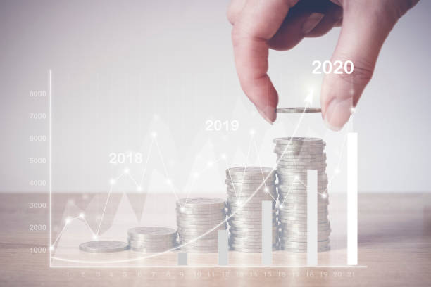 istock Hand putting money coin on line rising, virtual hologram statistics, graph and chart with arrow up on light background. Stock market. Business growth, planing and strategy concept. Digital marketing. 1252680272