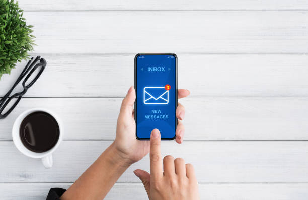Modern Correspondence. Unrecognizable Woman Checking Inbox Email Messages On Smartphone Modern Correspondence. Unrecognizable Woman Checking Inbox Email Messages On Smartphone During Coffee Break In Office, Top View e mail inbox photos stock pictures, royalty-free photos & images