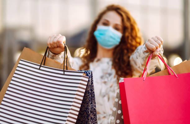 istock Shopping bags in the hands. 1252680976