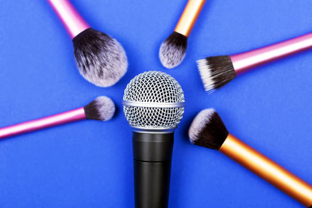 istock A microphone with many brushes decorated with confetti. 1252682693