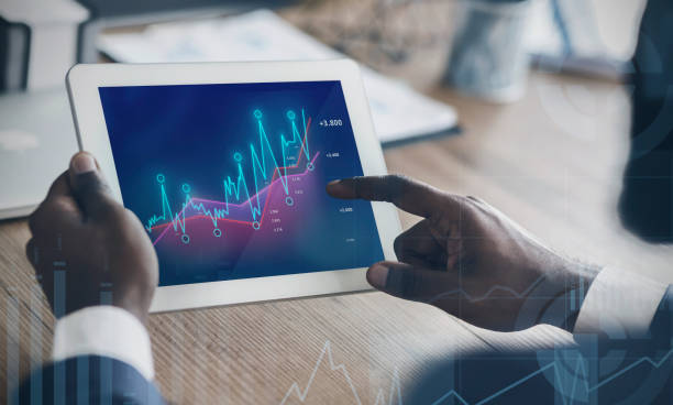 istock African American entrepreneur working with tablet computer, studying increasing financial graphs at office, collage 1252682953