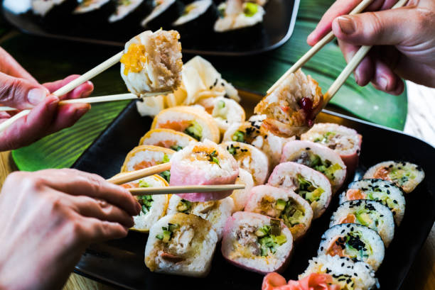 istock Sushi and roll set on wooden table. Selective focus 1252683009