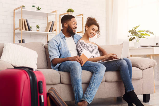 istock Happy Couple Using Laptop Booking Hotel For Vacation At Home 1252684509