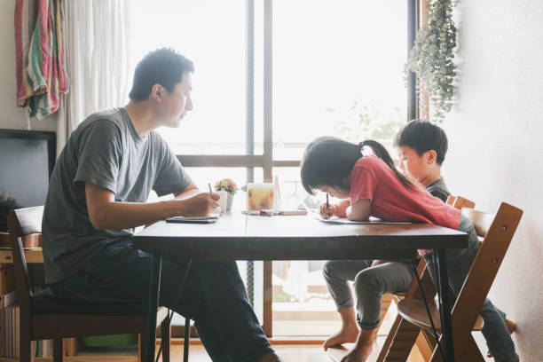 istock Father working at home with children 1252685280