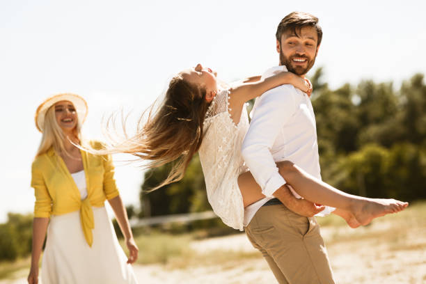 istock Happy Family Spending Time Together Walking Outdoors On Summer Day 1252685515