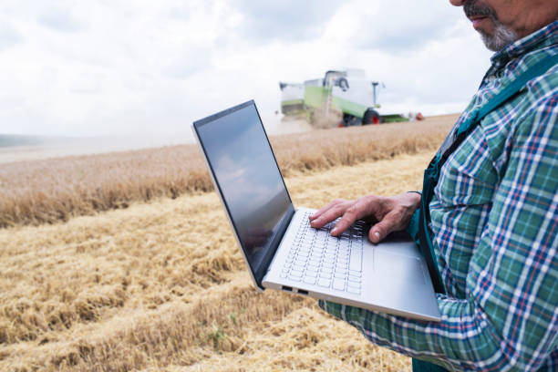 istock Farmer Using Laptop On Agriculture Field. 1252686952