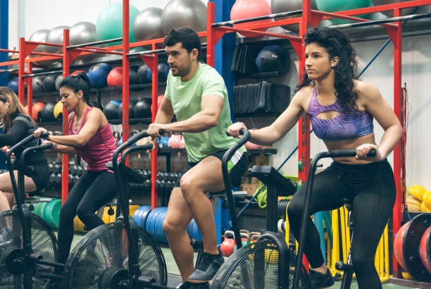 istock Athletes doing air bike indoor 1252689003