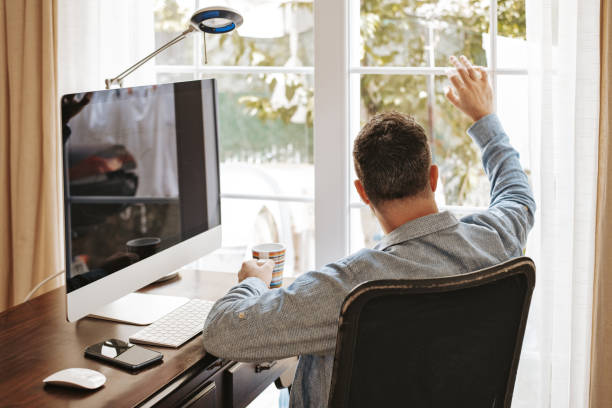 istock Male freelancer working break and drinking coffee 1252689385