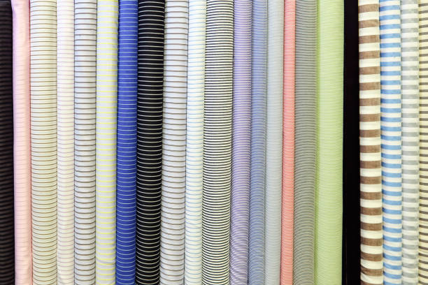 istock Bright background image. Rolls of different striped fabric 1252689725