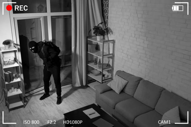 istock Thief With Crowbar Entering Into House View From Camera 1252690600
