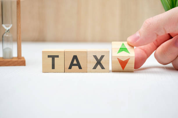 istock Tax concept with up and down arrows. 1252690982