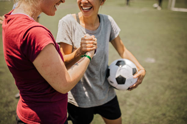 istock Female soccer players talking about tactics before training 1252691651
