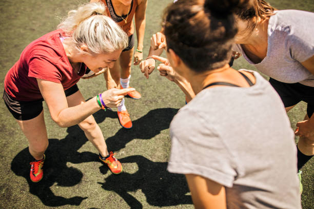 istock Female soccer players talking about tactics before training 1252691704