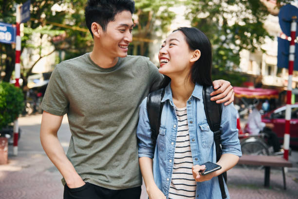 istock Smiling Couple Walking In City 1252691779