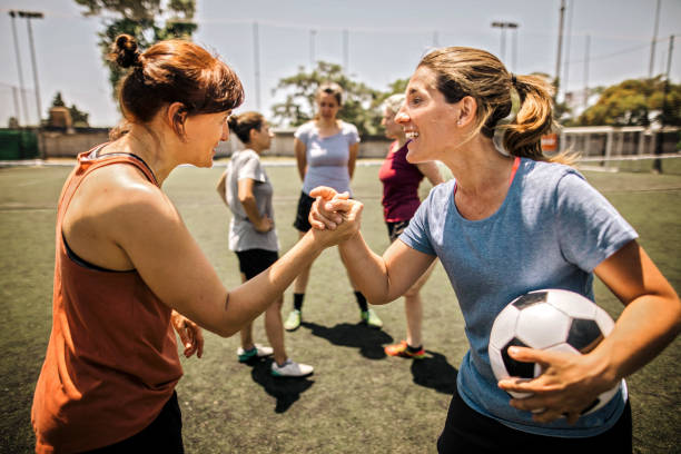 istock Female soccer players talking about tactics before training 1252692058