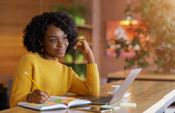 istock Creative freelancer girl thinking on new project, working at cafe 1252696788