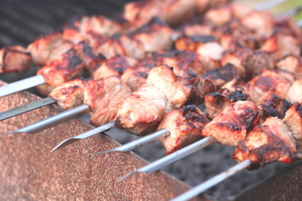 istock Cooking meat on skewers in barbecue 1252698920