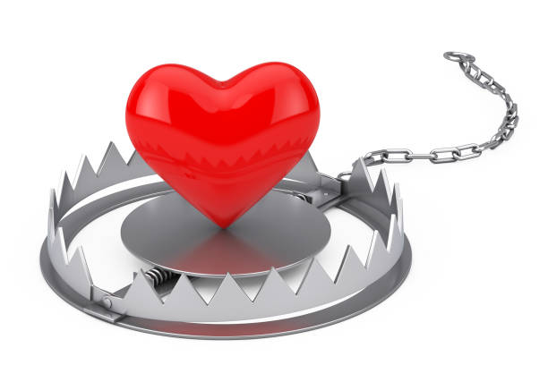 istock Metal Bear Trap with Red Heart. 3d Rendering 1252699121