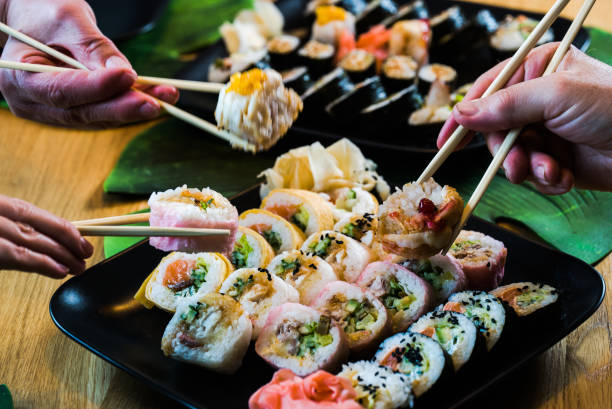 istock Sushi and roll set on wooden table. Selective focus 1252701924