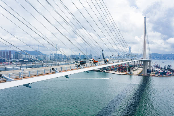 istock Highway Bridge in Hong Kong and Container Cargo freight ship 1252702021